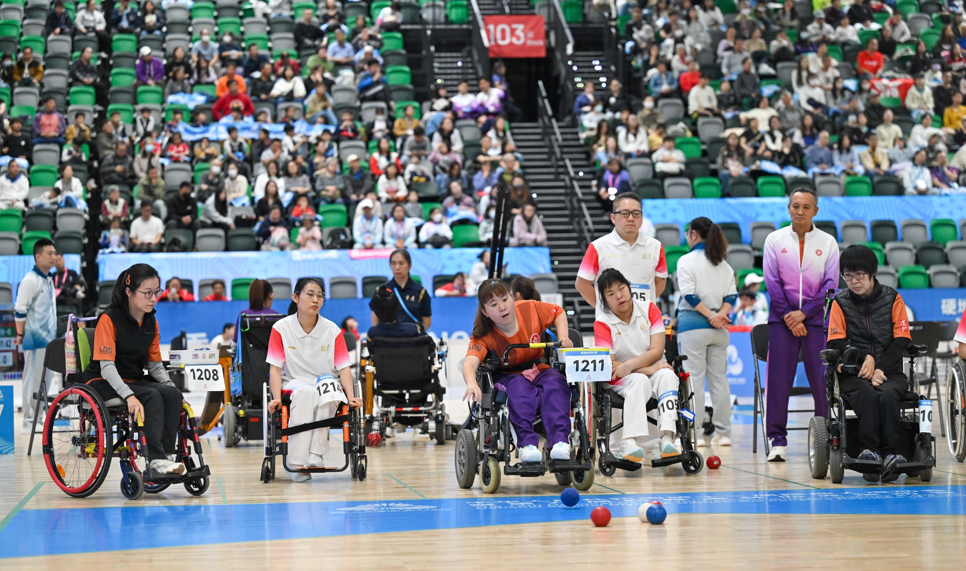The double and group finals of the boccia competition of the 12th National Games for Persons with Disabilities and the 9th National Special Olympic Games was held at Kai Tak Arena, Kai Tak Sports Parkon on December 14. Photo shows Hong Kong athletes competing at the Women's Group BC1/BC2 event.